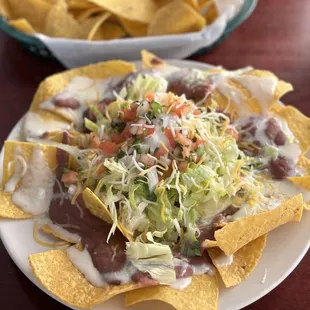 Bean and cheese nachos. So delicious. The salad on top was so fresh.