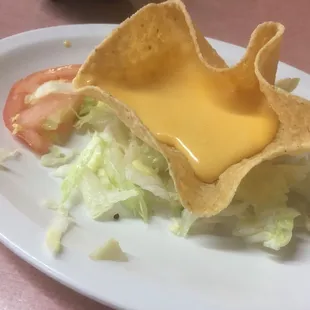 Very odd nacho chip with waxy tasting cheese. Was also served chips so I don't get the point. My dinner had salad and tomatoes just weird.