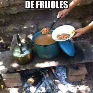 a person preparing food in a pot