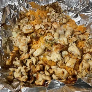 Pollo con arroz (chicken with rice and melted cheese)
