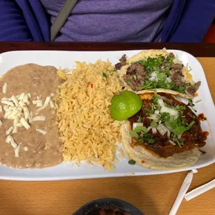 Two tacos and rice and beans