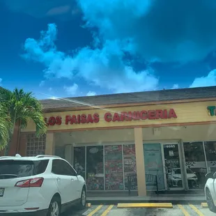 cars parked in front of the store