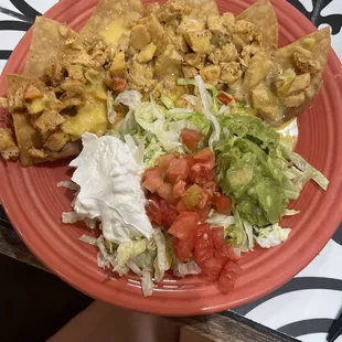 Chicken fajita nachos with queso on top!!