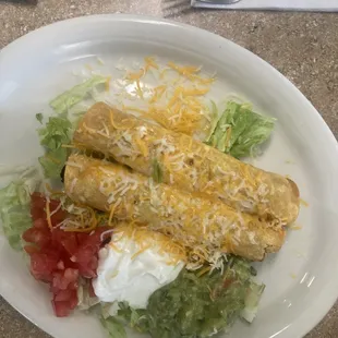 Two chicken taquitos
