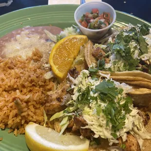 Grilled chicken tacos, rice and beans.