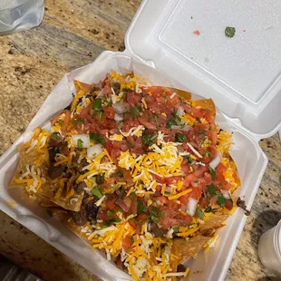 nachos in a styrofoam container