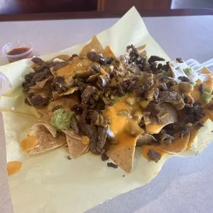 Carne asada chips with extra cheese being charged $1.50 for but I think they didn&apos;t add it