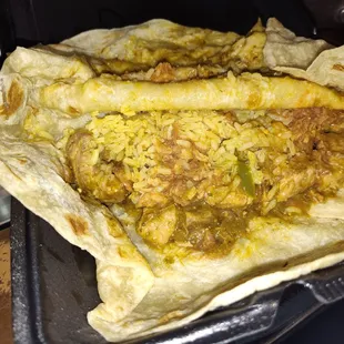 A Chile Verde burrito w/ beans an rice it was suppose to have onion and Cilantro