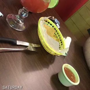 Complementary chips and salsa. They make the chips fresh so be patient. Strawberry margarita and Budlight