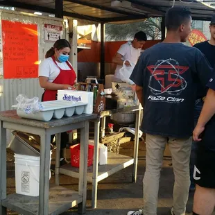 a group of people preparing food