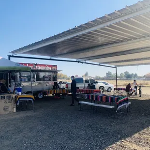 a food truck parked under a canopy