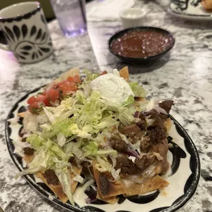 Taco Tuesday Special: mini nachos with steak is legit $9
