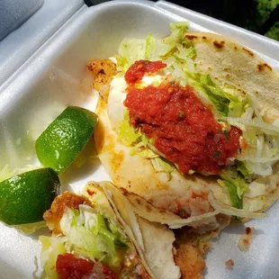 Fish tacos and shrimp tacos with food coloring salsa