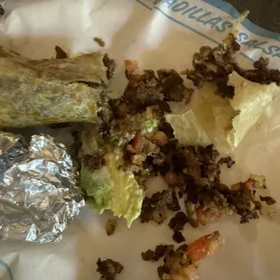 Burt grinds on crispy tortilla. Worst Mexican food. Taco Bell does better