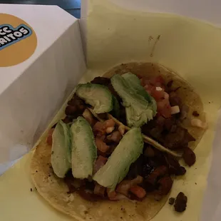 Adobo chicken tacos on corn tortilla