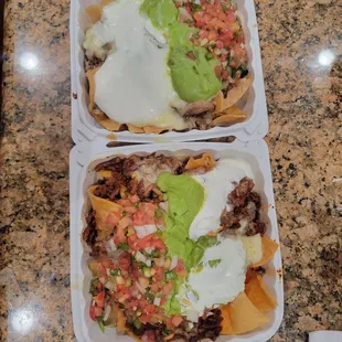 $12.25 Super Nachos ea. Top is Carne Asada, bottom is Al Pastor. Thick chips held up! Perfect for MNF (9/12/22)