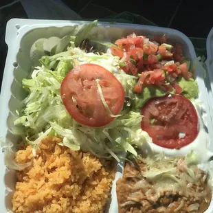 There's a cabeza crispy taco hidden under that mound of lettuce.