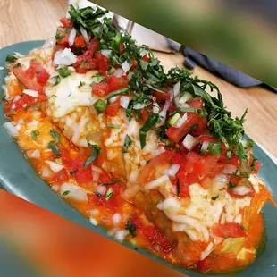 The wet burrito topped with my favorite sides...this place does wet burrito the best anywere