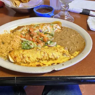 Fajita enchiladas (beef and chicken) beans an rice.