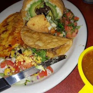 The fried avocado was stuffed with beef, surrounded by cheese , lightly battered and fried. Served with a taco and a cheese enchilada.