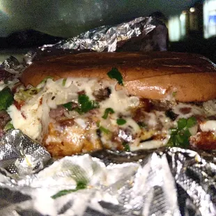 Asada Torta with everything on it (cilantro, onions, avacado, tomato)