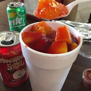 Mangonado. Snow cone w chopped mango &amp; Mexican chamoy (chile condiment). Good stuff.