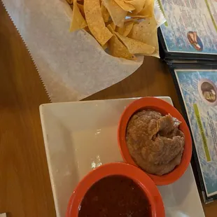 Complimentary chips, bean dip, and salsa