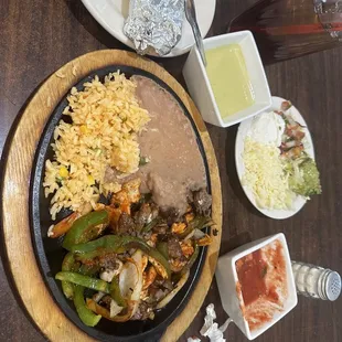 18 dollars for combo fajitas and they give you 3 strips of beef and chopped chicken...walking out now.