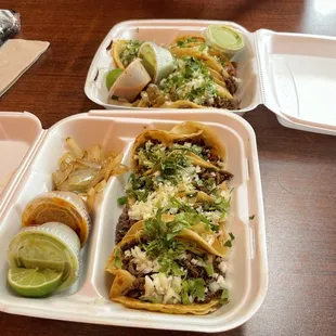 two trays of food on a table