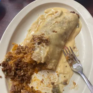 a plate of enchiladas and rice