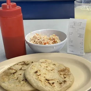 Queso y Pupusa De Ayote & Wueso y Pupusa De Pollo with cabbage slaw and red sauce. Pineapple angua Fresca.