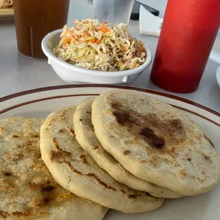 Pupusas, curtido, rice.