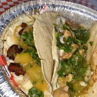 al pastor and chicken queso taco
