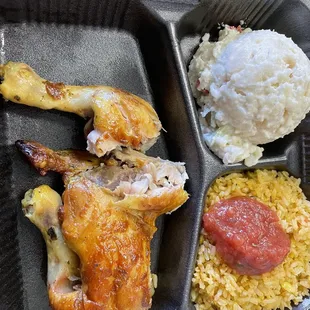 a meal of chicken, rice, and pepperoni