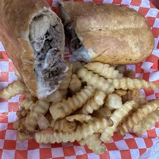 Steak chimichanga with crinkle fries.