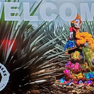 a statue of a mexican woman in a colorful dress