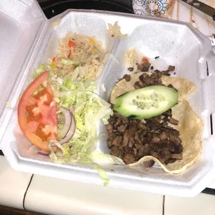 Carne Assad tacos. No toppings, but they were still good. Grubhub delivered.