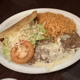 Single Carne Asada taco Plate with rice &amp; beans, food always taste excellent here