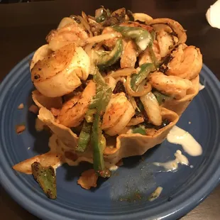 Shrimp taco salad before we noticed it was "soupy".