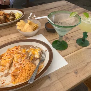 a table with mexican food and drinks