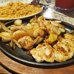 a plate of chicken and potatoes