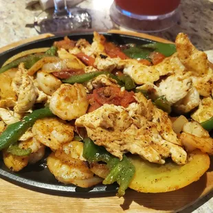 a plate of chicken and peppers