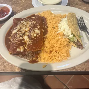 Combination with 2 enchiladas, rice and taco.