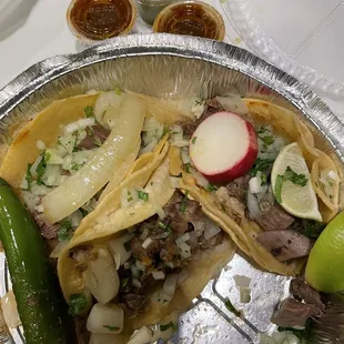 4 Tacos via Delivery. (Note: 1 eaten) Lengua extra $2. Came with salsas. Jalapeño and radish received upon request. Total $16.99. Nov 2023.