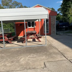 Outside eating and front of building.