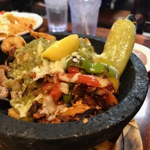The Molcajete, packed full of Steak, Chicken, Shrimp and Fajita Vegetables