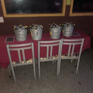 four buckets of food on a table