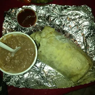 Carne Steak Burrito with beans on the side.