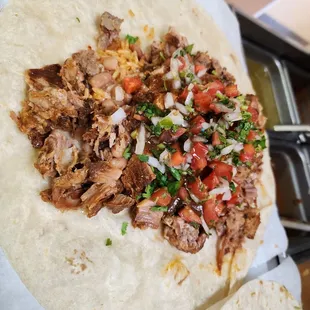 a pork taco on a tortilla