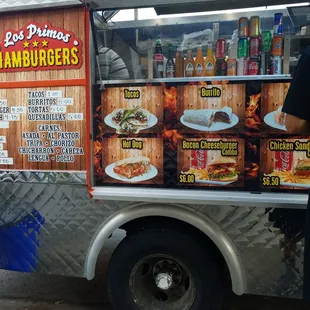 a man standing in front of a food truck